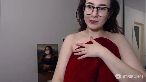 Brunette camgirl with glasses oils up her huge tits