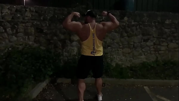Muscle flexing after gym in the carpark 