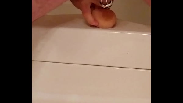 Man in Chastity fucks dildo hard