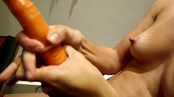 Indian babe in mask plays with vegetables 