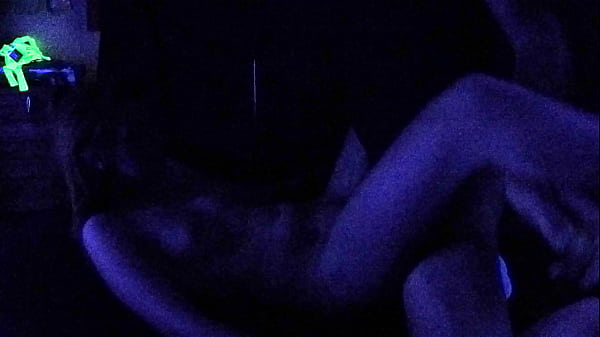 Whore gets artsy and fucks under glowing blacklight