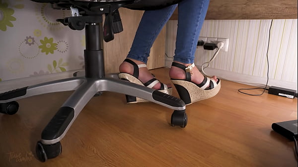 Sneaky voyeur watches feet in high heels under table