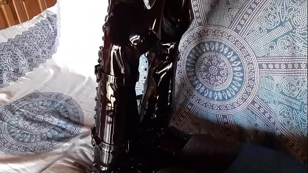 Total black with fishnets pantyhose and boots over the knee 