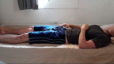 Hot guy teases himself through his shorts after the gym