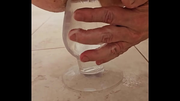 Fucking my man cunt with a large clear butt plug 