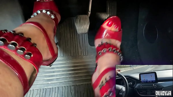 Red high heels driving 