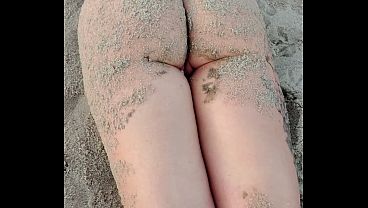 POV You as a busty model unaware of your presence strips naked on the beach bathes and masturbates in the sand