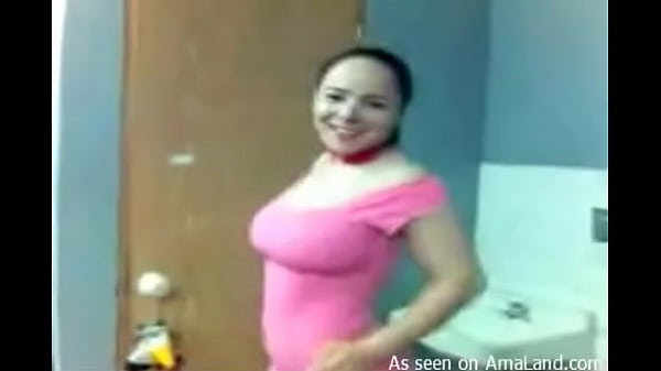 Busty Latina in_pink strips in the bathroom