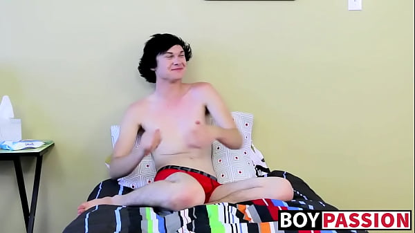 Twink tugs on his massive cock and uses dildo on his ass