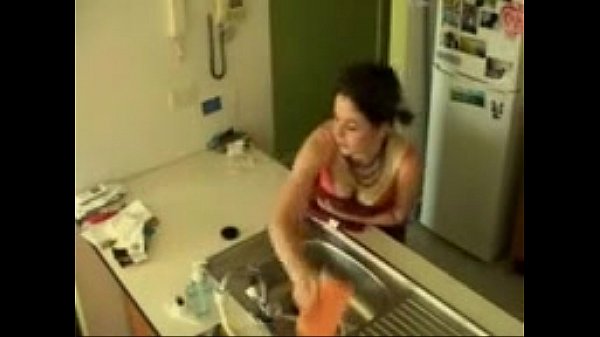 Brunette teen has an intense orgasm masturbating in theKitchensink