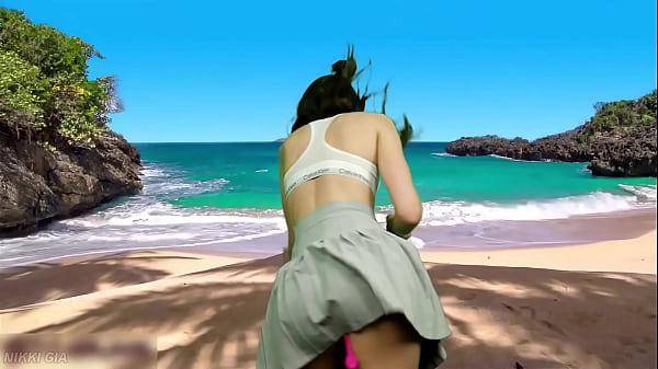 She's dancing on the beach without panties