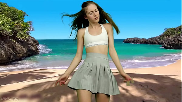She's dancing on the beach without panties 