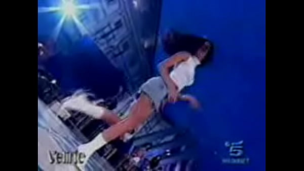 Hot italian beauty shows upskirt as she dances during a performance 