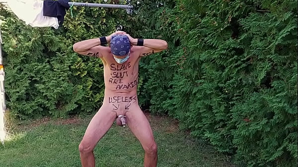 naked pathetic dirty white slave in penis cage striptease at outdoor party humiliating body writing, CMNM