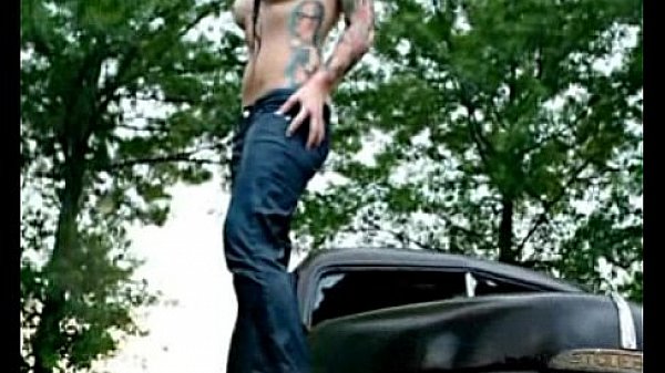 Very cute tattoo girl under the rain 