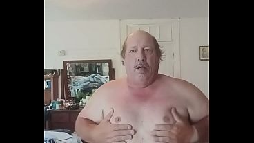 In girls dress playing with tits