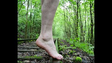 On the Edge: Seductive Soles Tease on Train Tracks