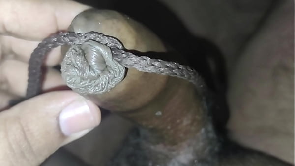 Play with tied foreskin peehole and inserting rod into dick tip 