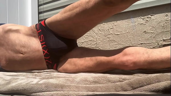 Stop Action Core Stretching on_Patio in_Black and Red Briefs