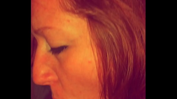 Redhead sucks and gets cum all over her face 