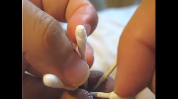 Insert the cotton swab into the urethra and spread peehole 