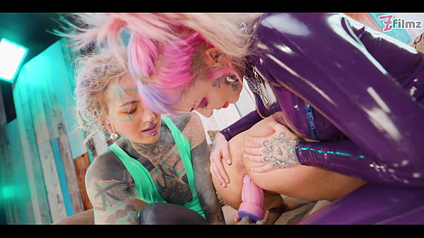 Two dominas gang up on goth chick to fill her holes with toys and make her cum 