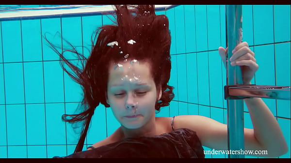 Brunette Nata Szilva stripsunderwater and gets horny