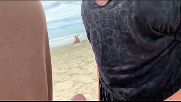 A busty blonde jerks off the first guy she meets in front of everyone... 