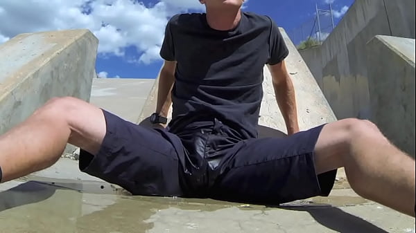 Pissing and cumming inside black shorts in_public