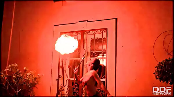 Flaming hot sexy pyromaniac plays with fire 