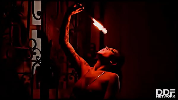 Flaming hot sexy pyromaniac plays with fire
