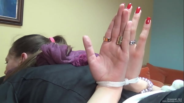 girl tied up in_bondage_with palms out