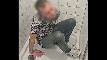 Playing in shower fully clothed with jeans and sneakers 