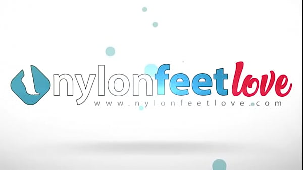 Bianca is so sexy while she smokes her cigarette and puts her feet in red rht stockings over the table