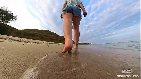 Barefoot walks over the summer seashore