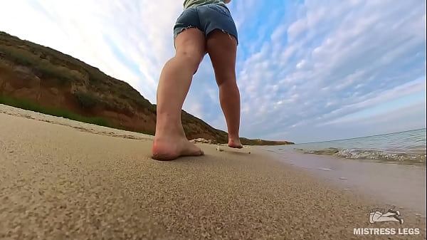 Barefoot walks over the summer seashore