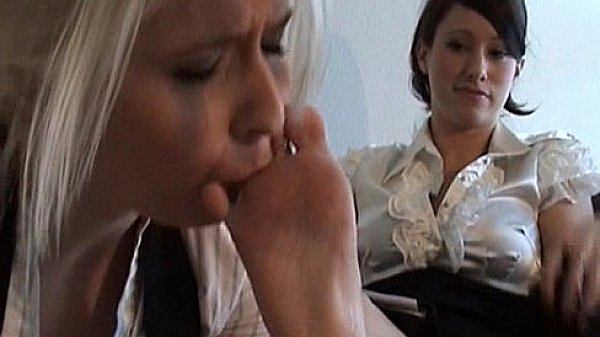 Lesbian reading a book while worshiping her feet 3