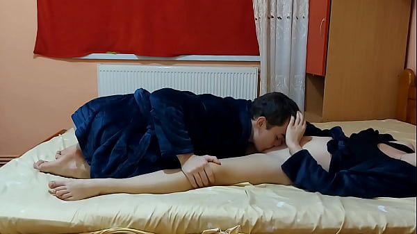 Young couple passionately make love in the bedroom 