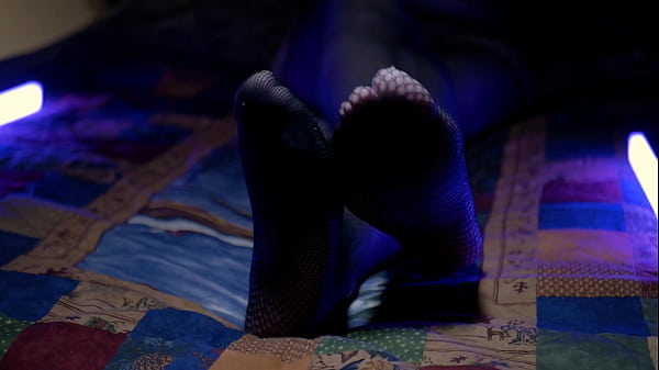 Perfect toes peeking through sexy fishnets 