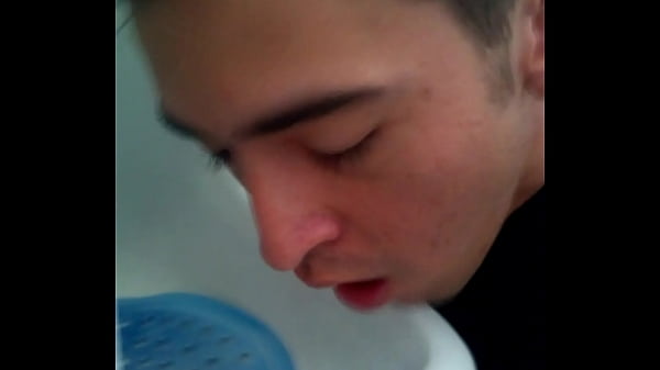 Faggot licking urinal 