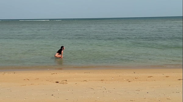 Slender beauty walks along the beach and swims in the sea meet me 