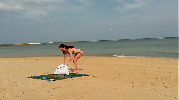 Slender beauty walks along the beach and swims in the sea. meet me
