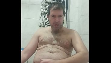 Masturbating a big cock in the bathroom