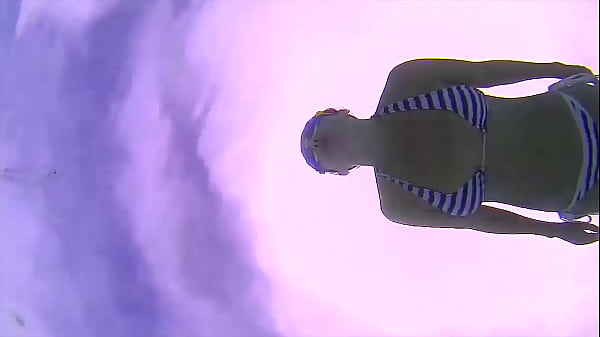 Amazing underwater bikini show.Elegant flexible babe swimming underwater in the_pool