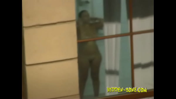 Play MP4 - A girl washes in the shower&comma; and we see her through the window