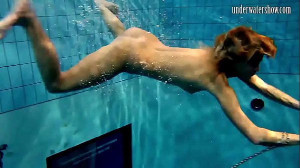 Croation teen Monica swims in the pool 