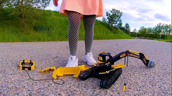 Large excavator is crushed smashed crushed broken plastic car crush toy car