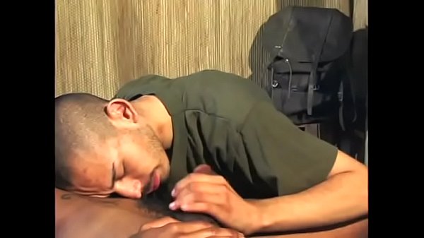 Gay black guy lies back and enjoys his partner blowing his cock 