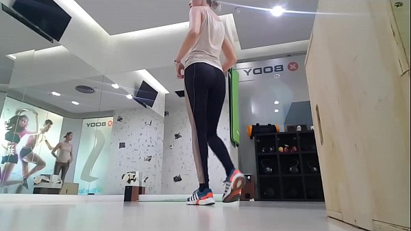 Blonde girl warming up before workout 