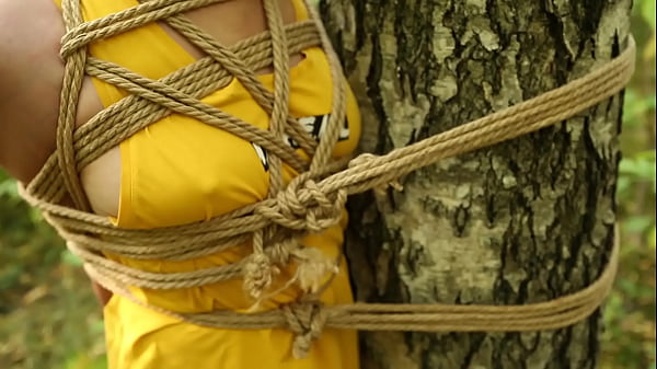 Girl Walking Tied Up In The Fall Woods thumbnail